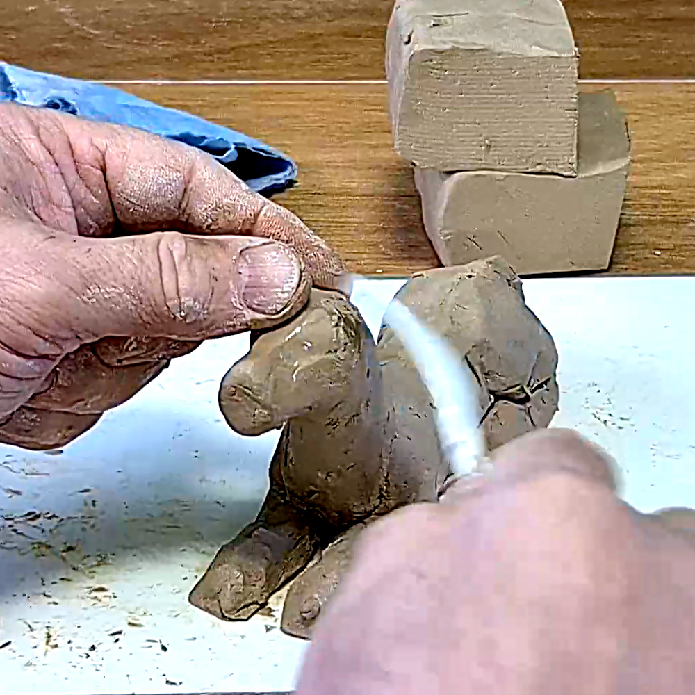 Natural clay dog ​​sculpture