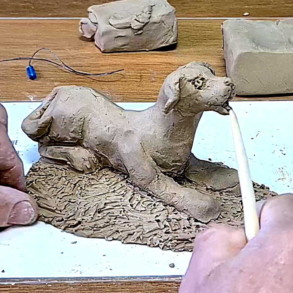 Natural clay dog ​​sculpture