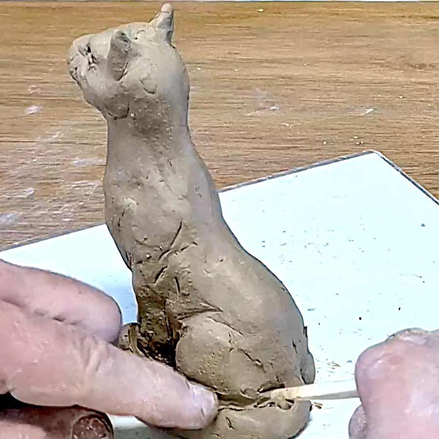 Cat sculpture from natural clay